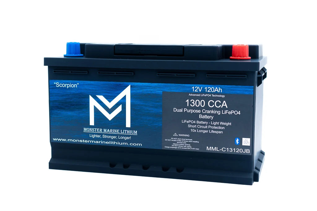 A Monster Marine Lithium 12V 120AH Scorpion dual purpose battery, model MML-C13120JB, shown on a solid white background. The battery features a black casing with a blue front label, a blue top section, a blue bottom base, a blue center logo, and red terminal caps on the top.