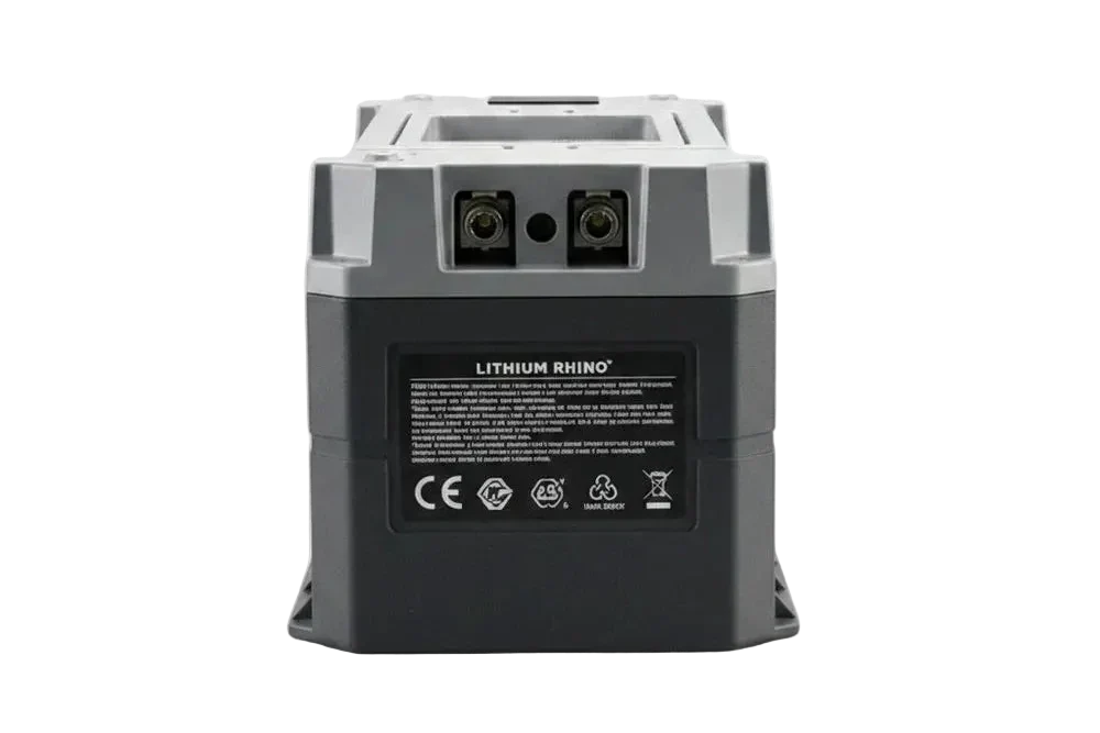 The rear view of a black and gray industrial lithium-ion battery pack, featuring terminal connectors on top and a white 'LITHIUM RHINO' label with regulatory markings.